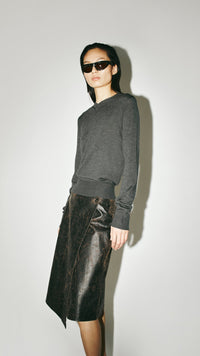 Styled view CAMILLA AND MARC Leona Knit V Neck Sweater in Charcoal with long sleeves and soft knit finish.