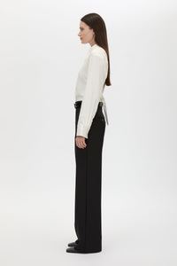 Side view CAMILLA AND MARC adjustable Tarn Fitted Long Sleeve Shirt in cream with removable shoulder pads.