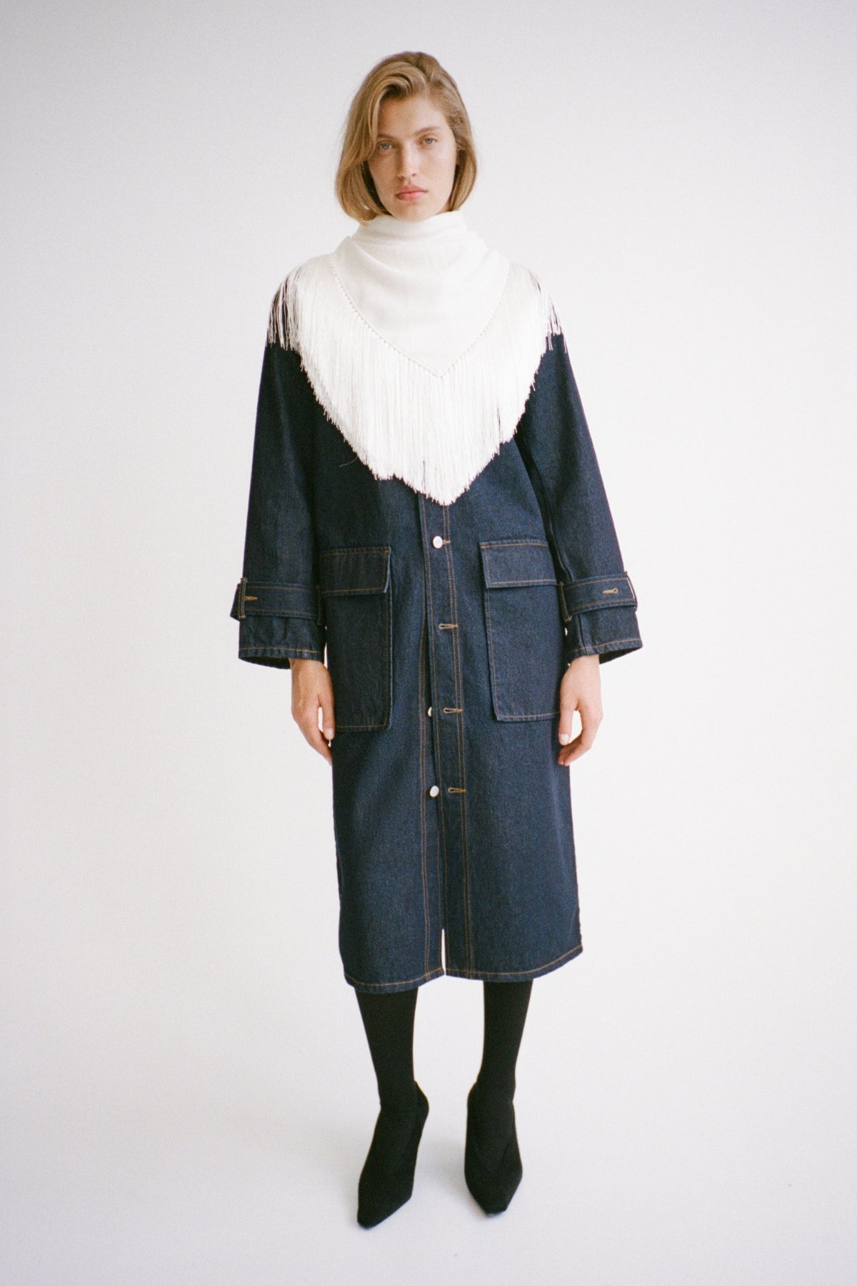 Styled view CAMILLA AND MARC Enzo Denim Coat in Indigo Blue with a contrast leather collar and dual‑entry patch pockets.