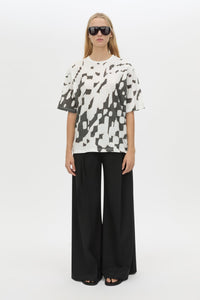 Front styled view CAMILLA AND MARC Asper Print Tee in Soft White with oversized short‑sleeve silhouette and printed artwork. 