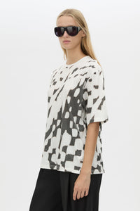 Cropped view CAMILLA AND MARC Asper Print Tee in Soft White with oversized short‑sleeve silhouette and printed artwork. 