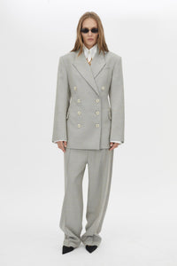 Front view CAMILLA AND MARC Aspira Blazer in Dusty Blue with a draped double‑breasted wool silhouette.