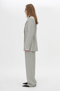 Side view CAMILLA AND MARC Aspira Blazer in Dusty Blue with a draped double‑breasted wool silhouette.
