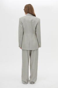 Back view CAMILLA AND MARC Aspira Blazer in Dusty Blue with a draped double‑breasted wool silhouette.