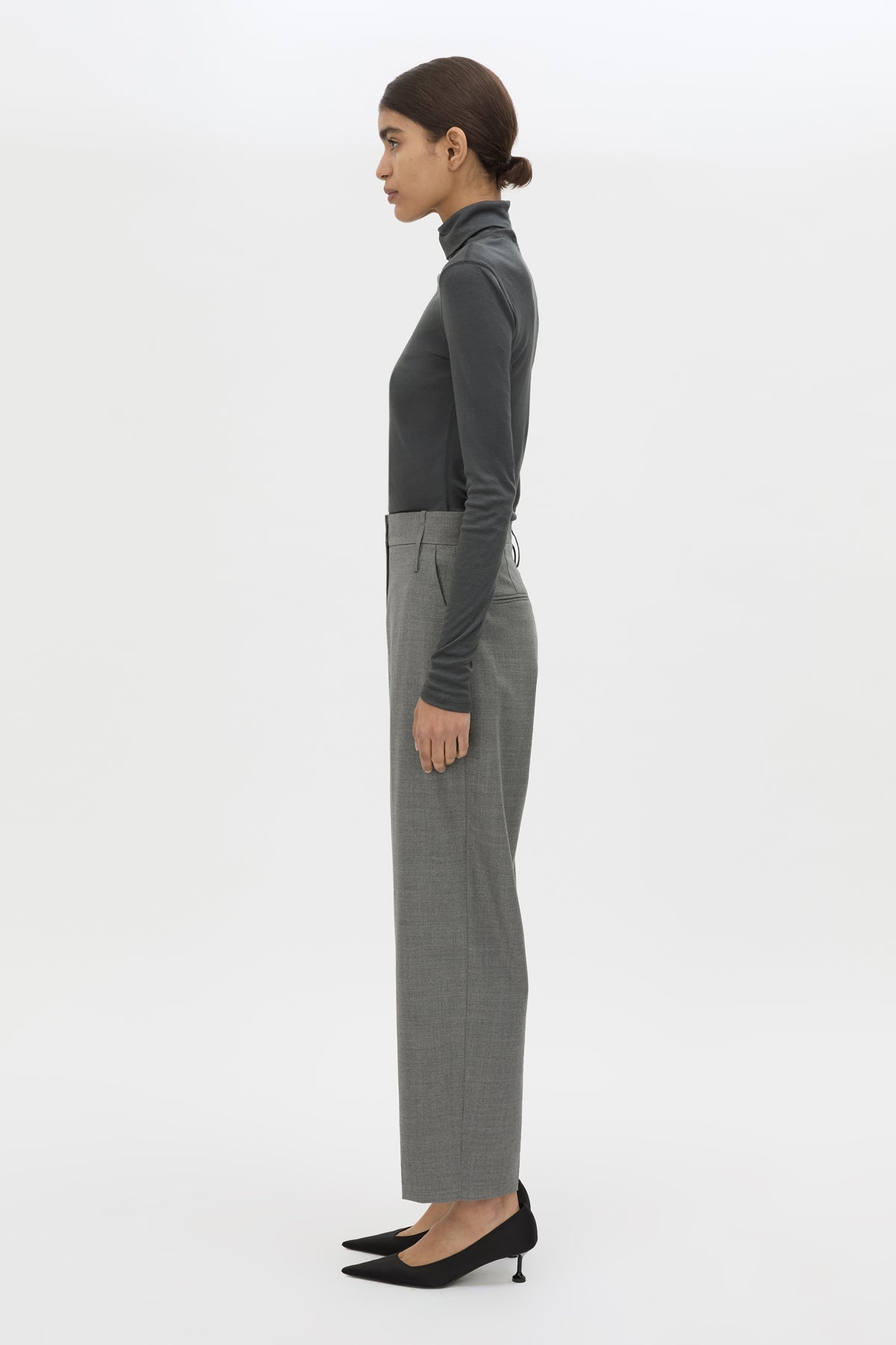Side view CAMILLA AND MARC Barre High Neck Top in Charcoal Grey with long sleeves and V‑neck split turtleneck.
