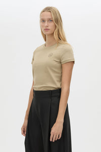 3/4 view CAMILLA AND MARC Bonnie fitted graphic baby tee in birch with centre front printed contrast artwork. 
