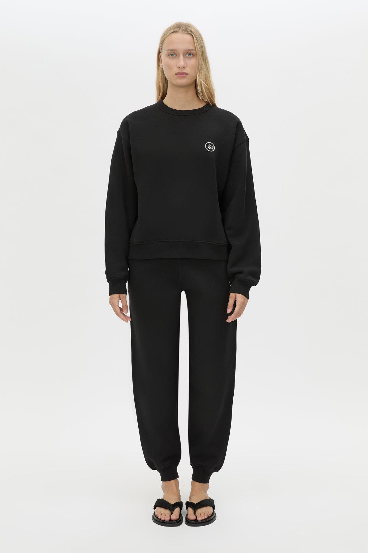 Front styled view CAMILLA AND MARC Bonnie Small Graphic Sweater in Black with relaxed fit and circle flocked artwork. 