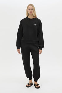 Front view CAMILLA AND MARC Bonnie Small Graphic Sweater in Black with relaxed fit and circle flocked artwork. 
