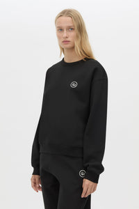 Cropped view CAMILLA AND MARC Bonnie Small Graphic Sweater in Black with relaxed fit and circle flocked artwork. 