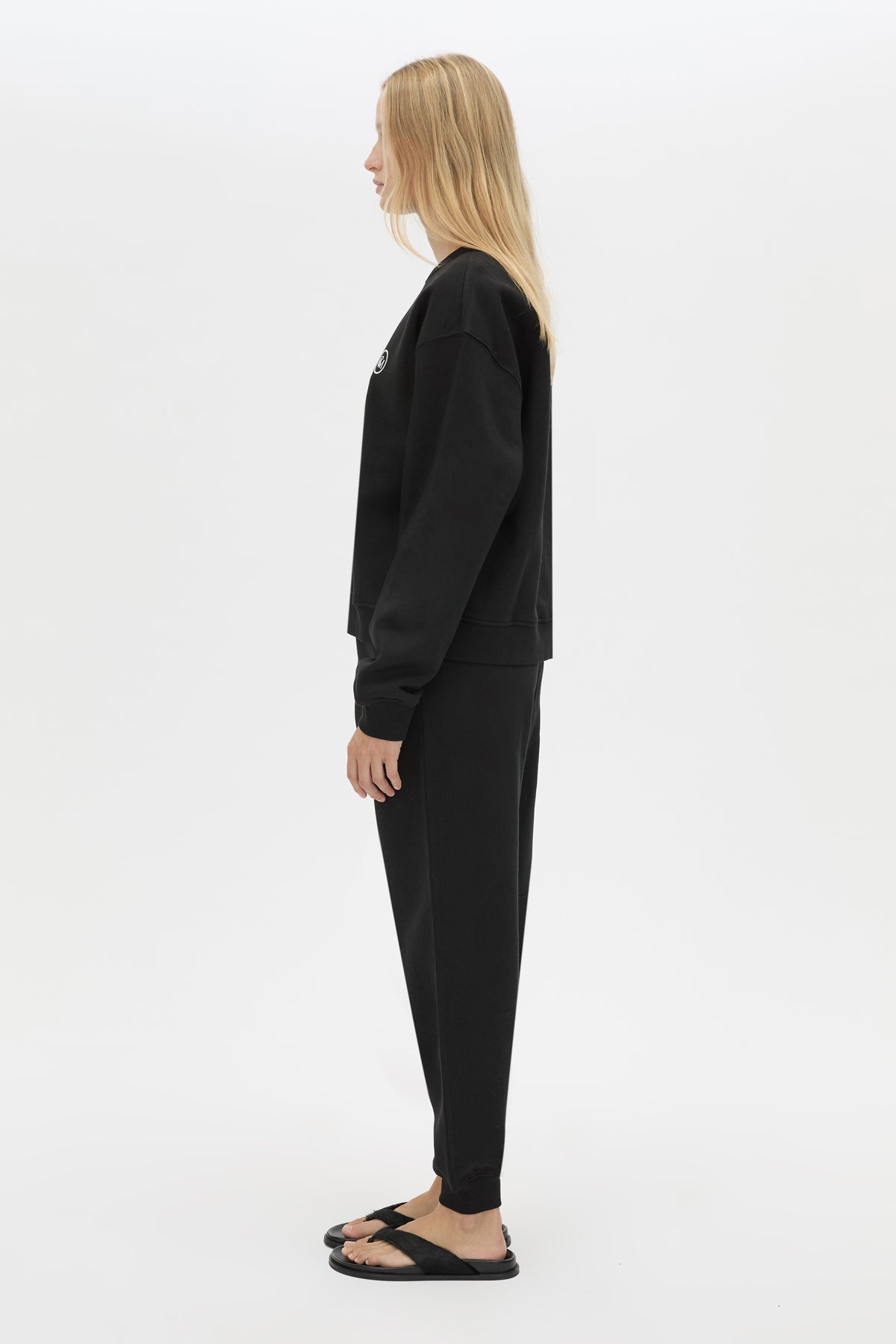 Side view CAMILLA AND MARC Bonnie Small Graphic Sweater in Black with relaxed fit and circle flocked artwork. 