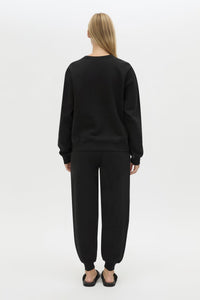Back view CAMILLA AND MARC Bonnie Small Graphic Sweater in Black with relaxed fit and circle flocked artwork. 