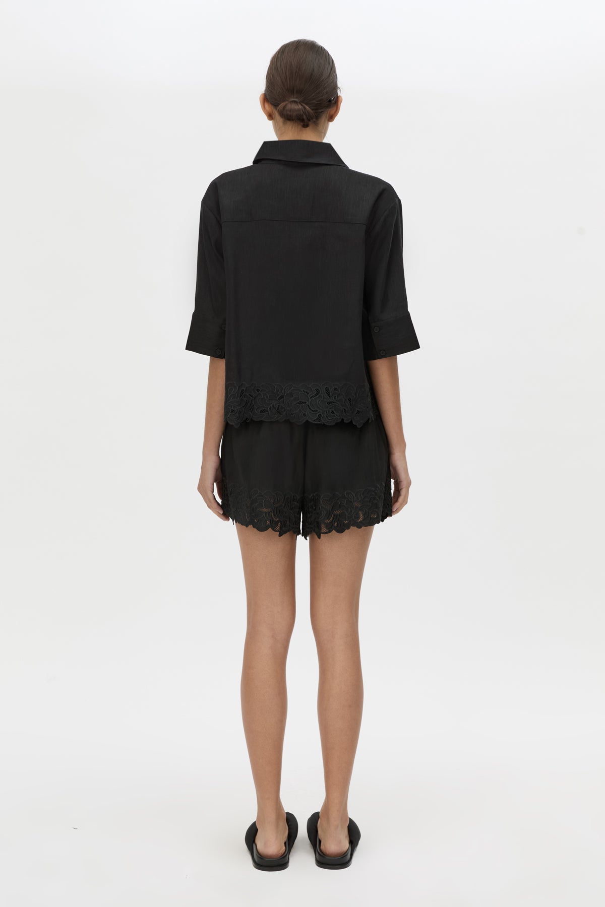 Back view CAMILLA AND MARC Chara Embroidered Short in black with embroidered hem and elasticated waistband.