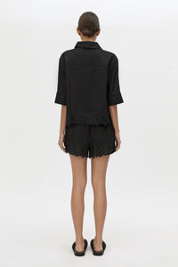 Back view CAMILLA AND MARC Chara Embroidered Short in black with embroidered hem and elasticated waistband.
