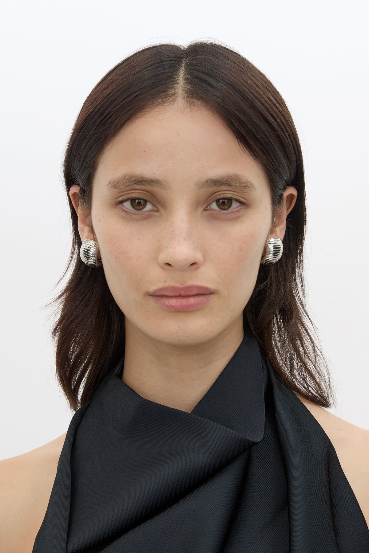 Front styled view CAMILLA AND MARC Connor Earrings in silver rhodium‑plated brass with geometric design.