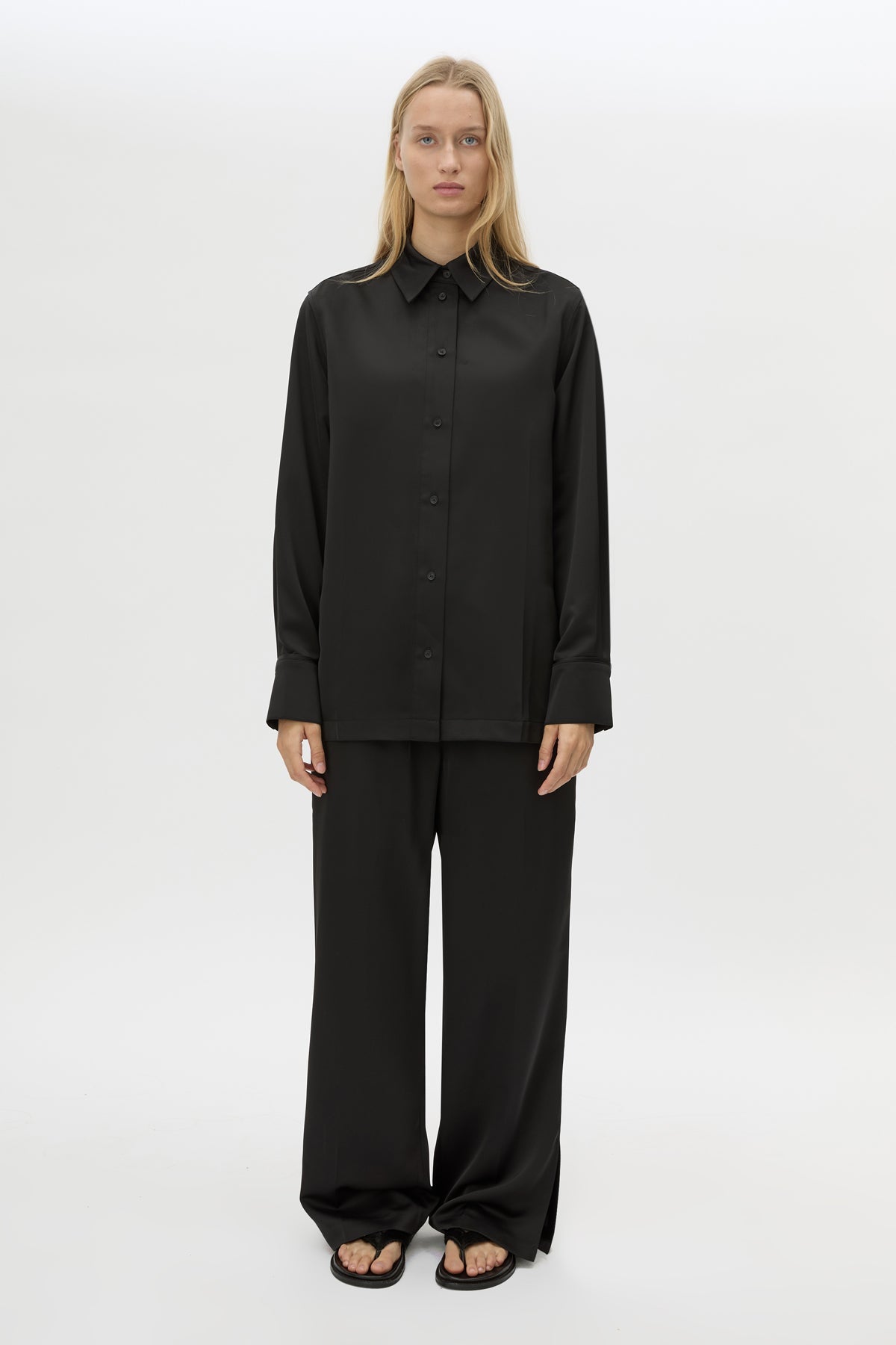 Front view CAMILLA AND MARC Ground Satin Long Sleeve Shirt in Black with collared neckline.