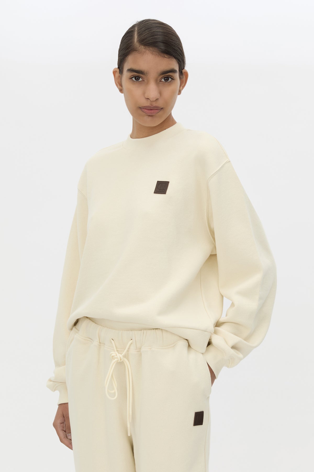 Cropped view CAMILLA AND MARC Idris Tracksuit Top in Ecru with folded rib crew neckline.