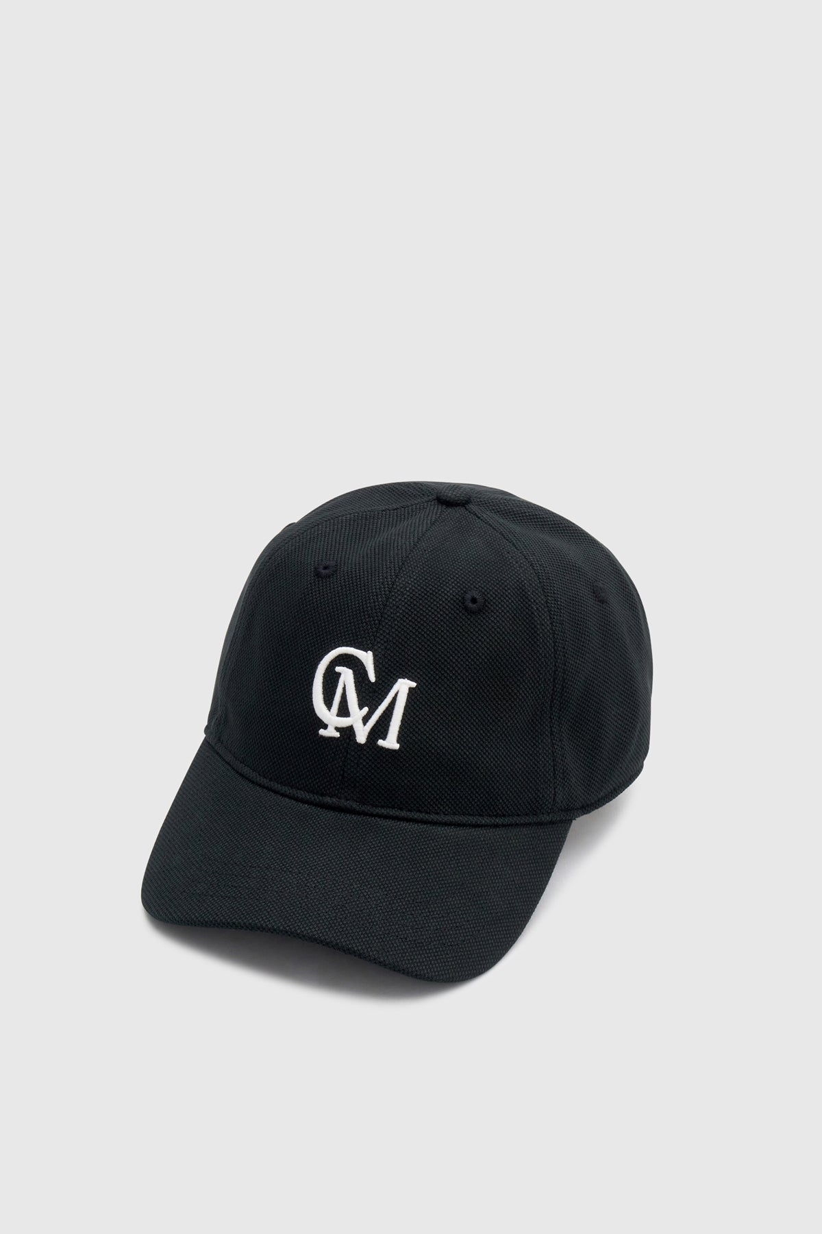 Ghost view CAMILLA AND MARC Isolde Embroidered Logo Cap in Black and White with front embroidered artwork.