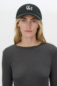 Front view CAMILLA AND MARC Isolde Embroidered Logo Cap in Black and White with front embroidered artwork.