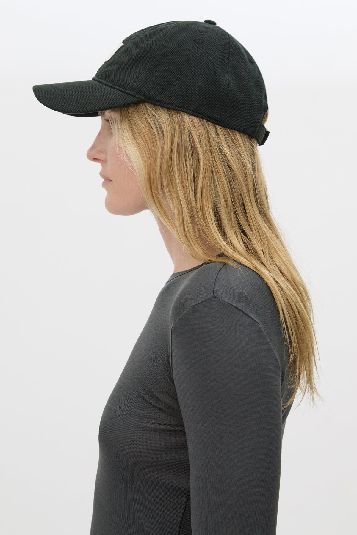 Side view CAMILLA AND MARC Isolde Embroidered Logo Cap in Black and White with front embroidered artwork.