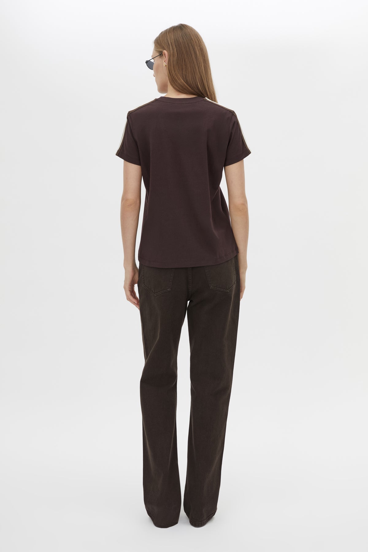 Back view CAMILLA AND MARC Locus Tee in Espresso with fitted baby‑tee silhouette and contrast stripe tape.  