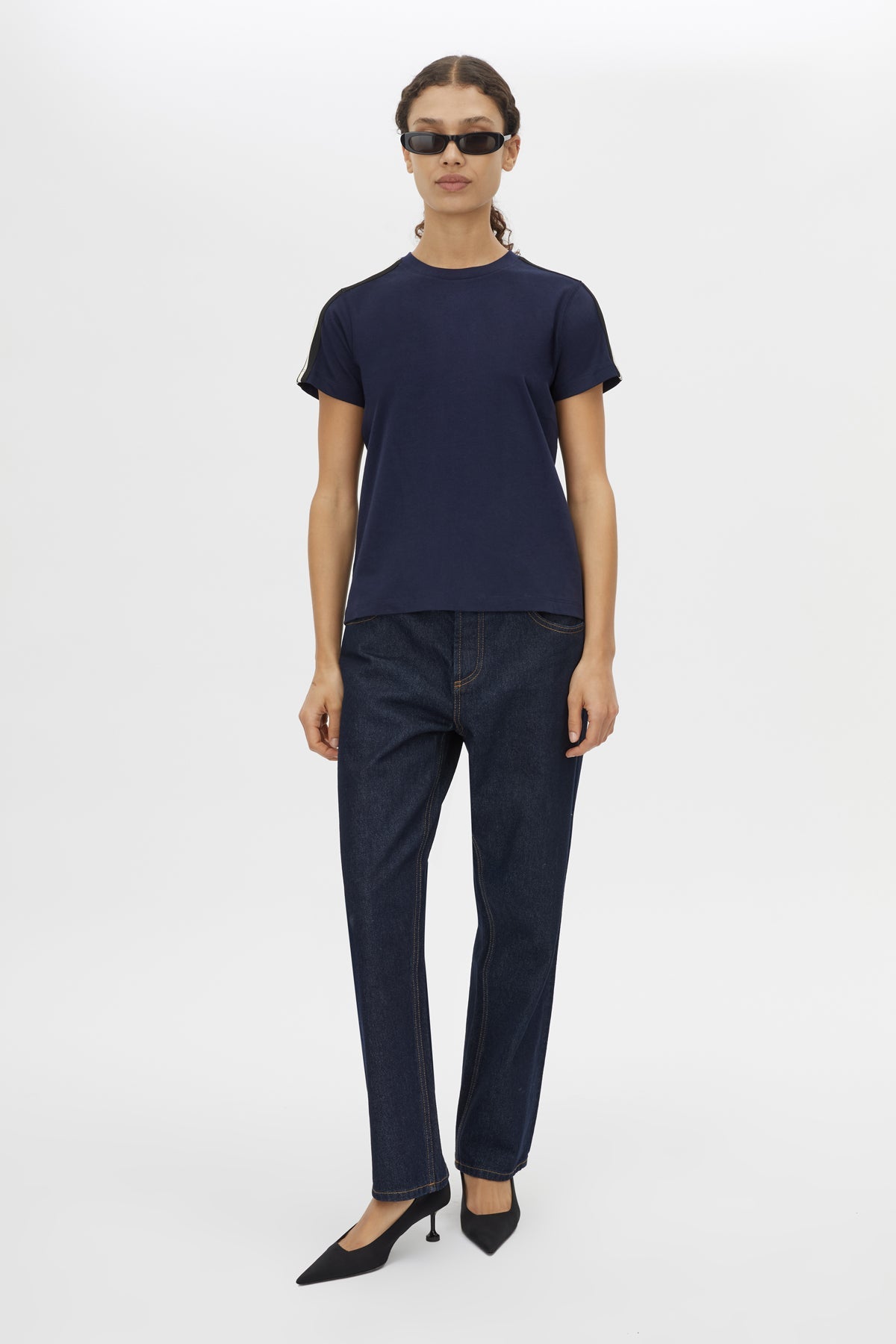 Front styled view CAMILLA AND MARC Locus Tee in Navy with fitted baby‑tee silhouette and contrast stripe tape.  