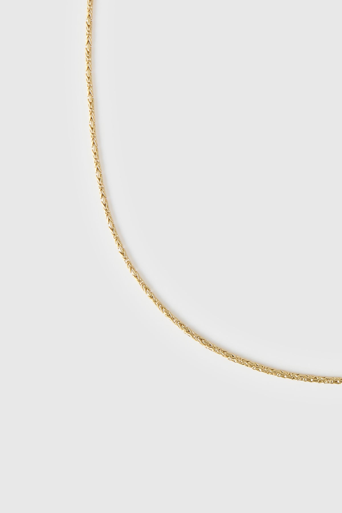 Cropped view CAMILLA AND MARC Logan Necklace finished 18k gold plating.