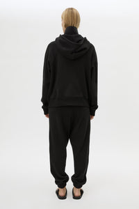 Back view CAMILLA AND MARC Lyra Embroidered Hoodie in Black and White with exposed quarter‑zip opening.