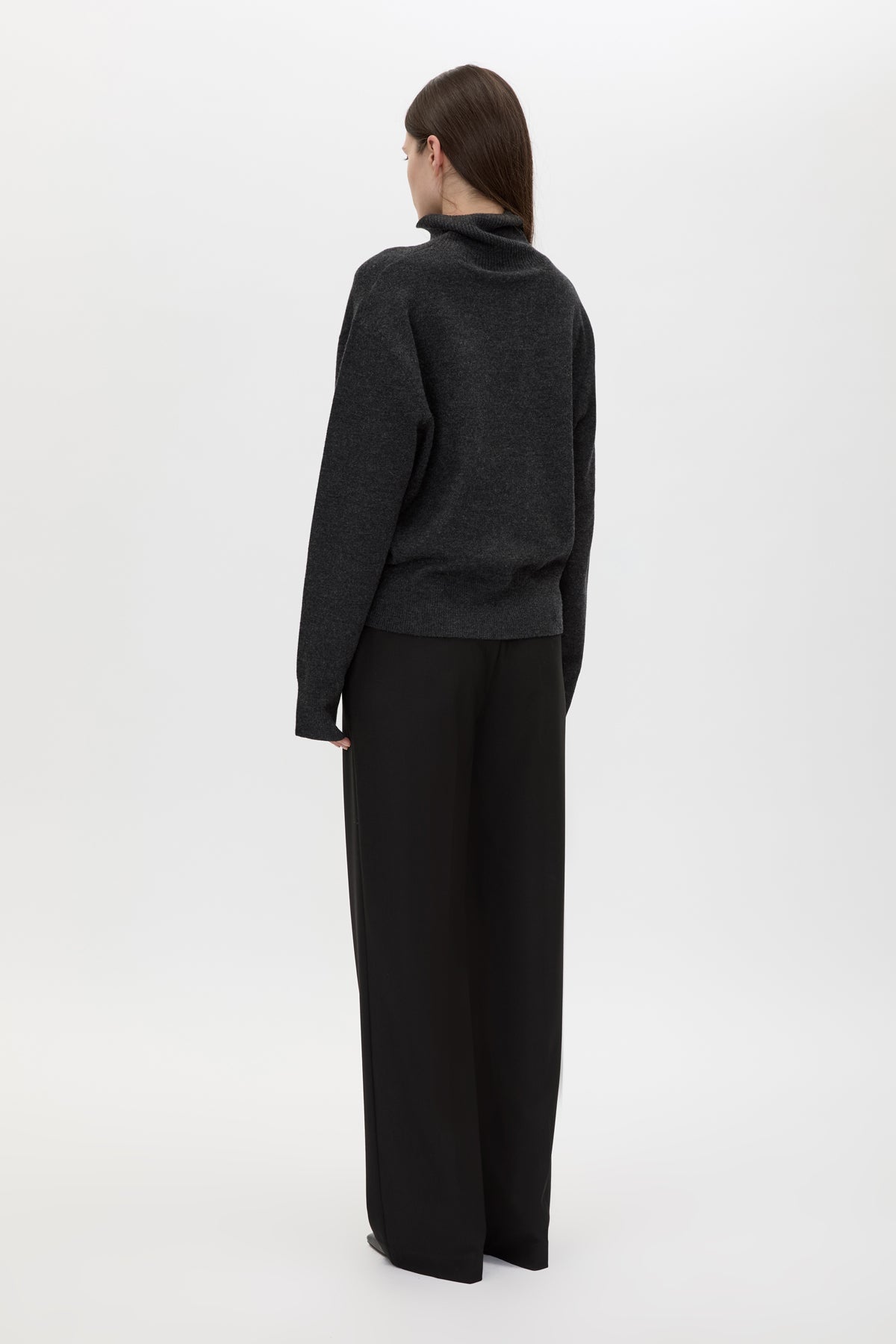 Back view CAMILLA AND MARC Margot Turtleneck Knit Sweater in Charcoal Grey with ribbed collar and hems.
