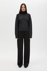 Front styled view CAMILLA AND MARC Margot Turtleneck Knit Sweater in Charcoal Grey with ribbed collar and hems.