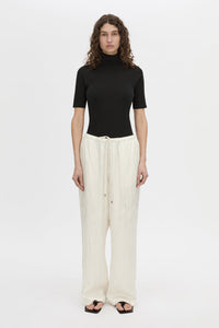 Front view CAMILLA AND MARC mid-rise Naidee Satin Relaxed Pant in ivory white with an elasticated gathered waistband.