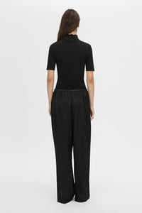 Back view CAMILLA AND MARC mid-rise Naidee Satin Relaxed Pant in black with an elasticated gathered waistband.