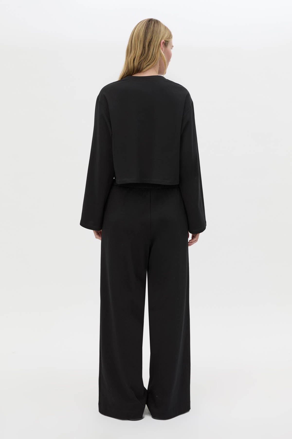 Back view CAMILLA AND MARC Niami Jersey Pant in black with a relaxed straight‑leg fit.