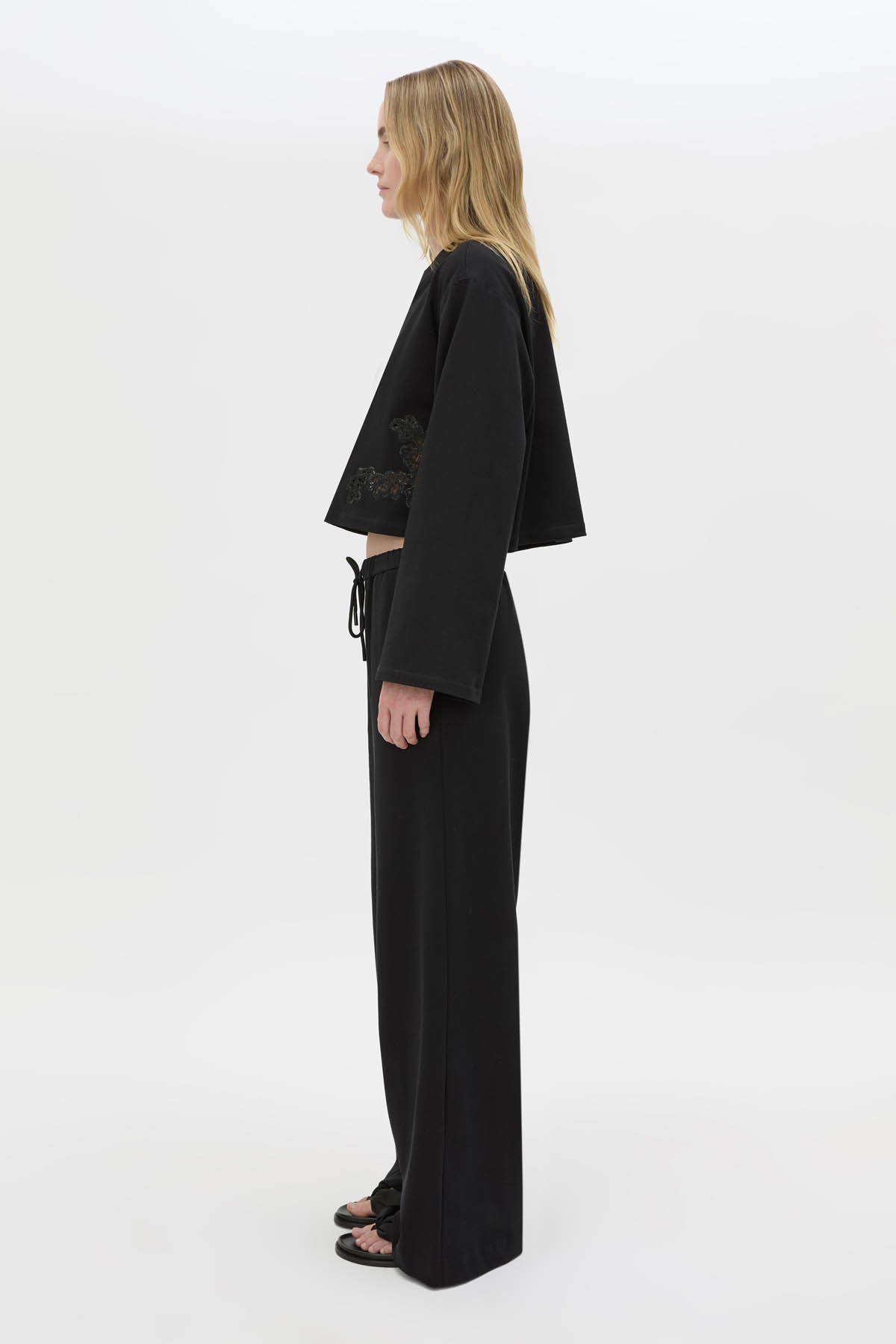 Side view CAMILLA AND MARC Niami Jersey Pant in black with a relaxed straight‑leg fit.