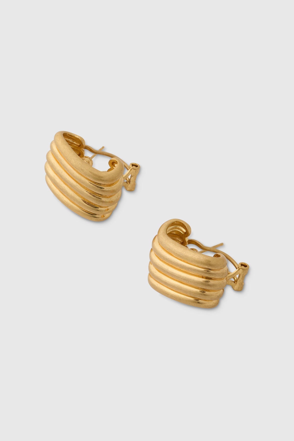 Ghost Three-quarter view CAMILLA AND MARC Odin Stud Earrings 18k gold plated geometric studs.