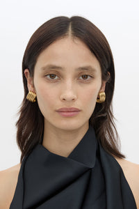 Front model view CAMILLA AND MARC Odin Stud Earrings 18k gold plated geometric studs.