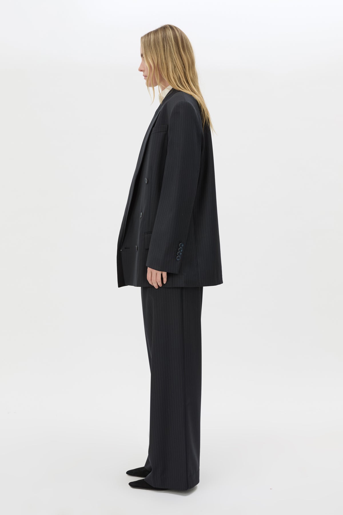 Side view CAMILLA AND MARC Orban Oversized Blazer in Navy pinstripe with double‑breasted button closure.