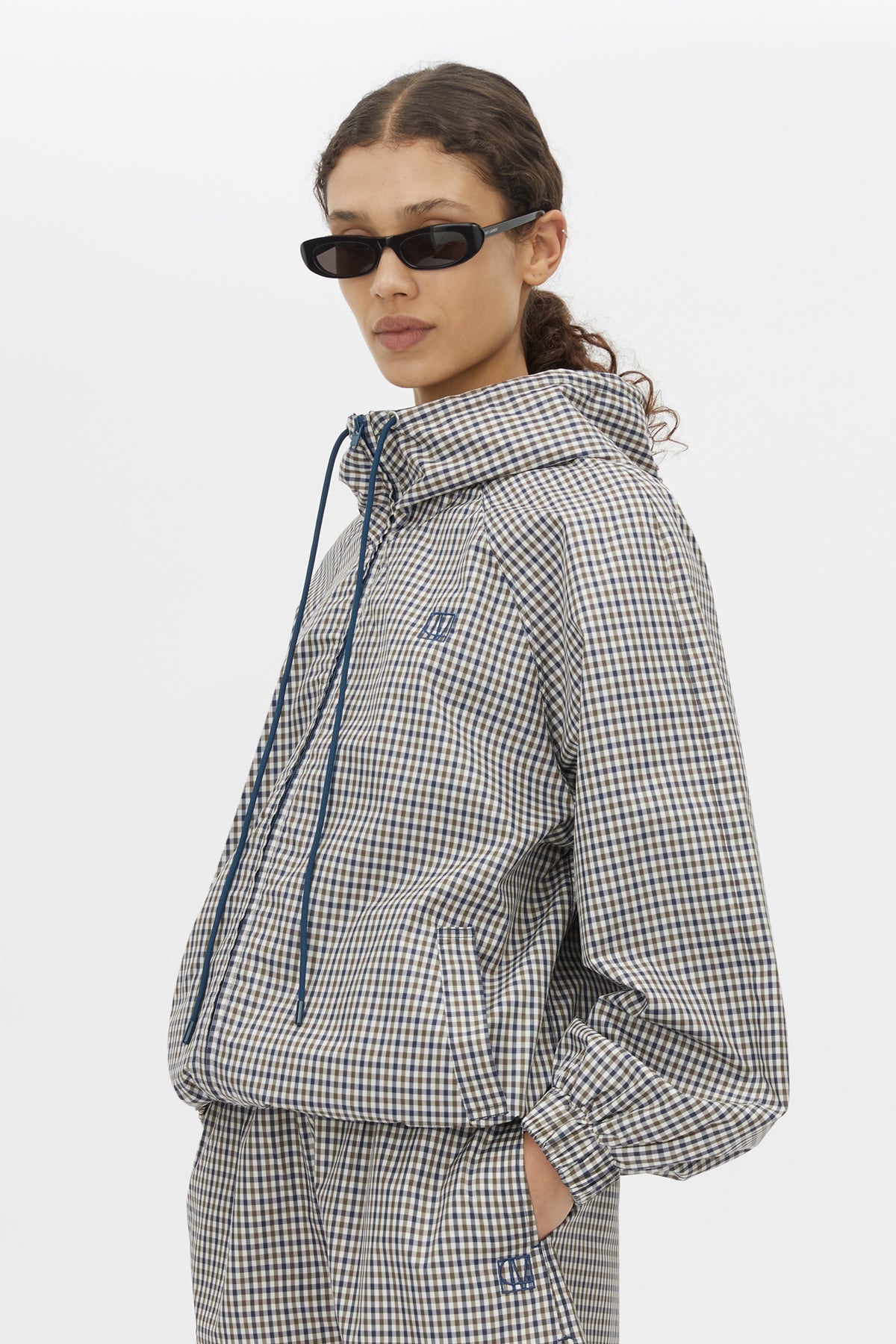 Cropped view CAMILLA AND MARC Pierce Check Anorak in Birch Check with hooded design and embroidered monogram.