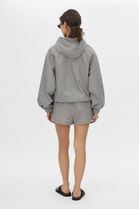 Back view CAMILLA AND MARC Pierce Check Anorak in Birch Check with hooded design and embroidered monogram.