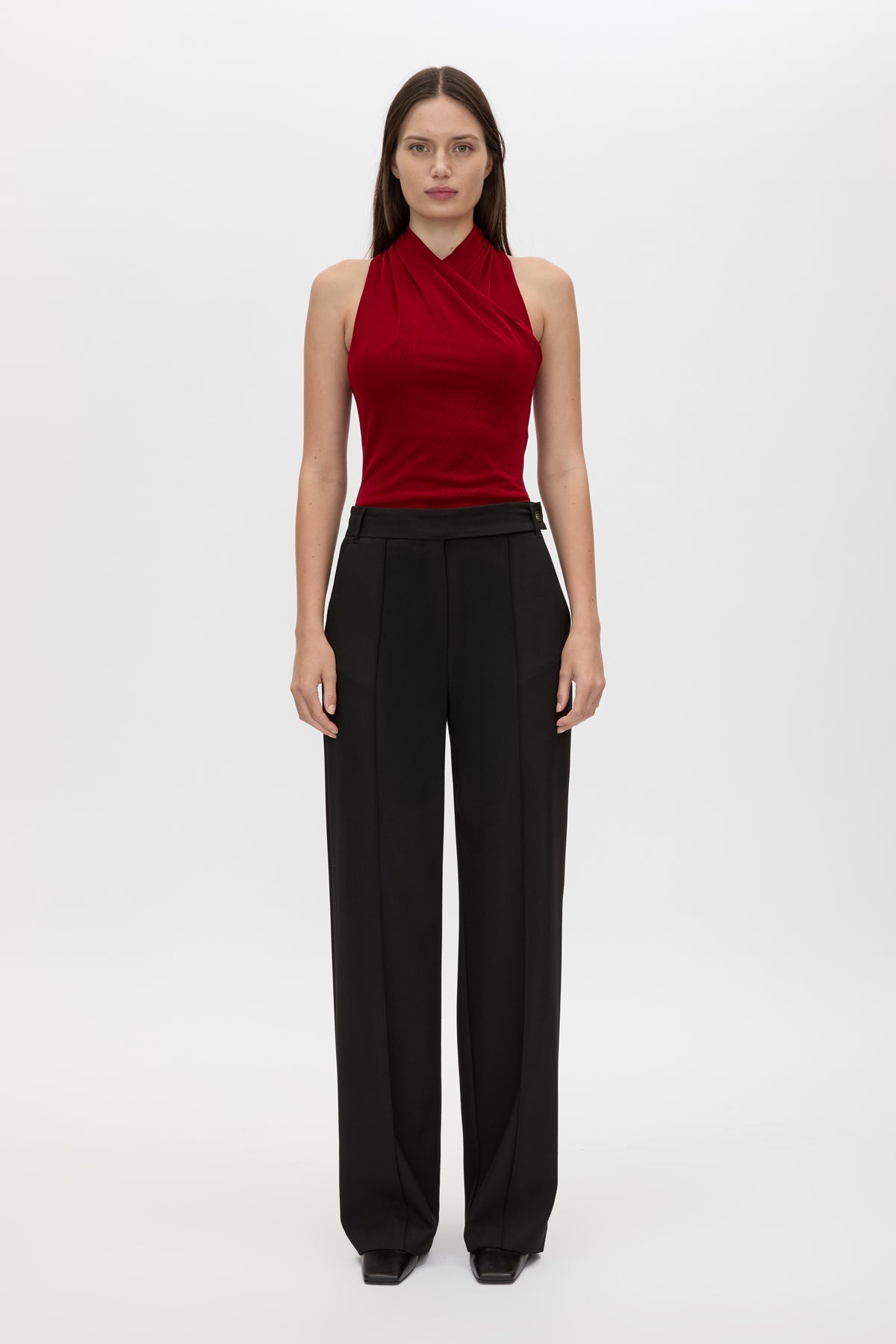 Front styled view CAMILLA AND MARC Ravine Bodysuit in Cherry Red with cross‑over neckline silhouette. 