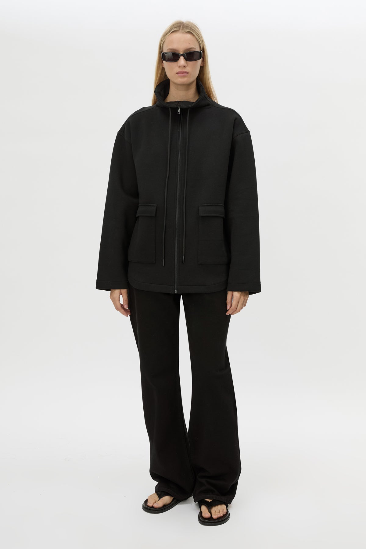 Front view CAMILLA AND MARC Salem Bonded Fleece Jacket in black with high collared neckline.