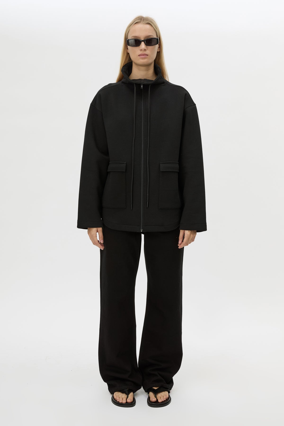 Front styled view CAMILLA AND MARC Salem Bonded Fleece Jacket in black with high collared neckline.