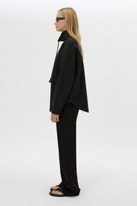Side view CAMILLA AND MARC Salem Bonded Fleece Jacket in black with high collared neckline.