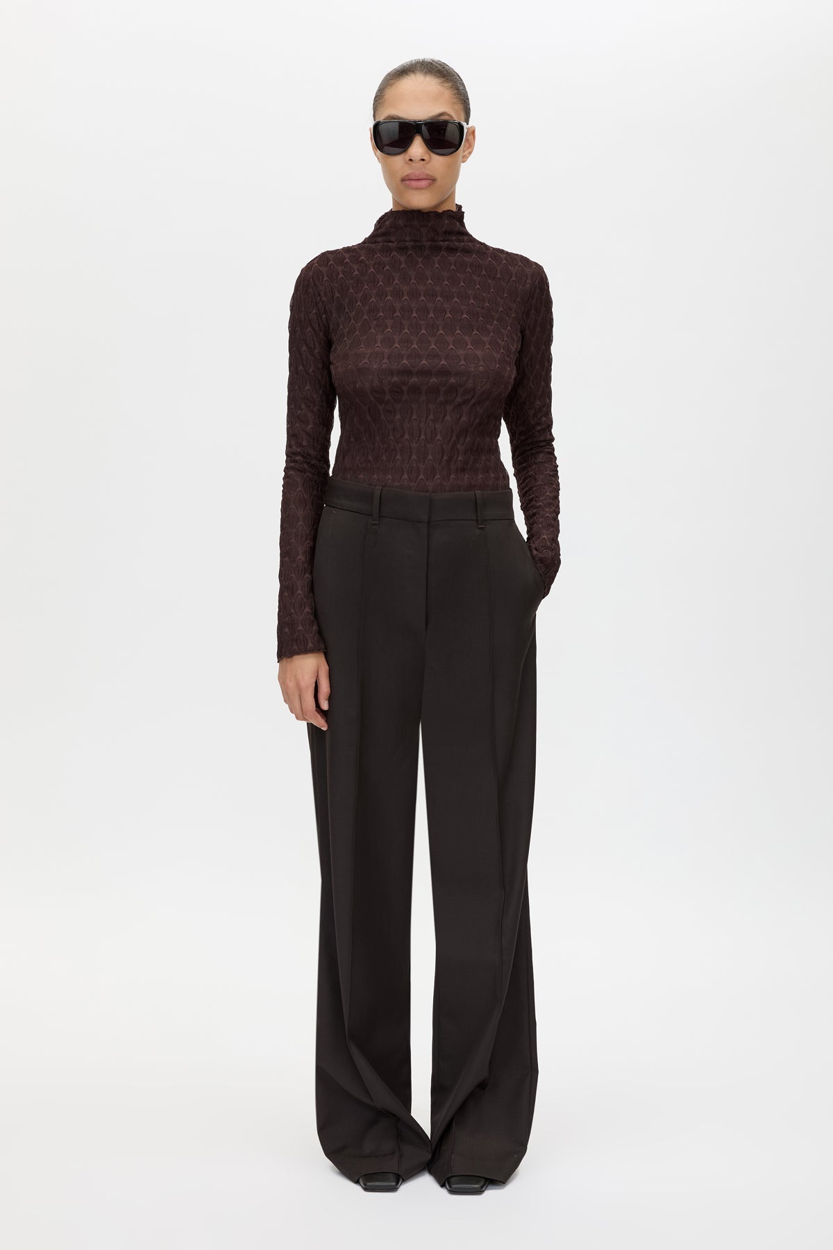 Front styled view CAMILLA AND MARC Sissil Top in Chocolate with long sleeves and funnel neckline.