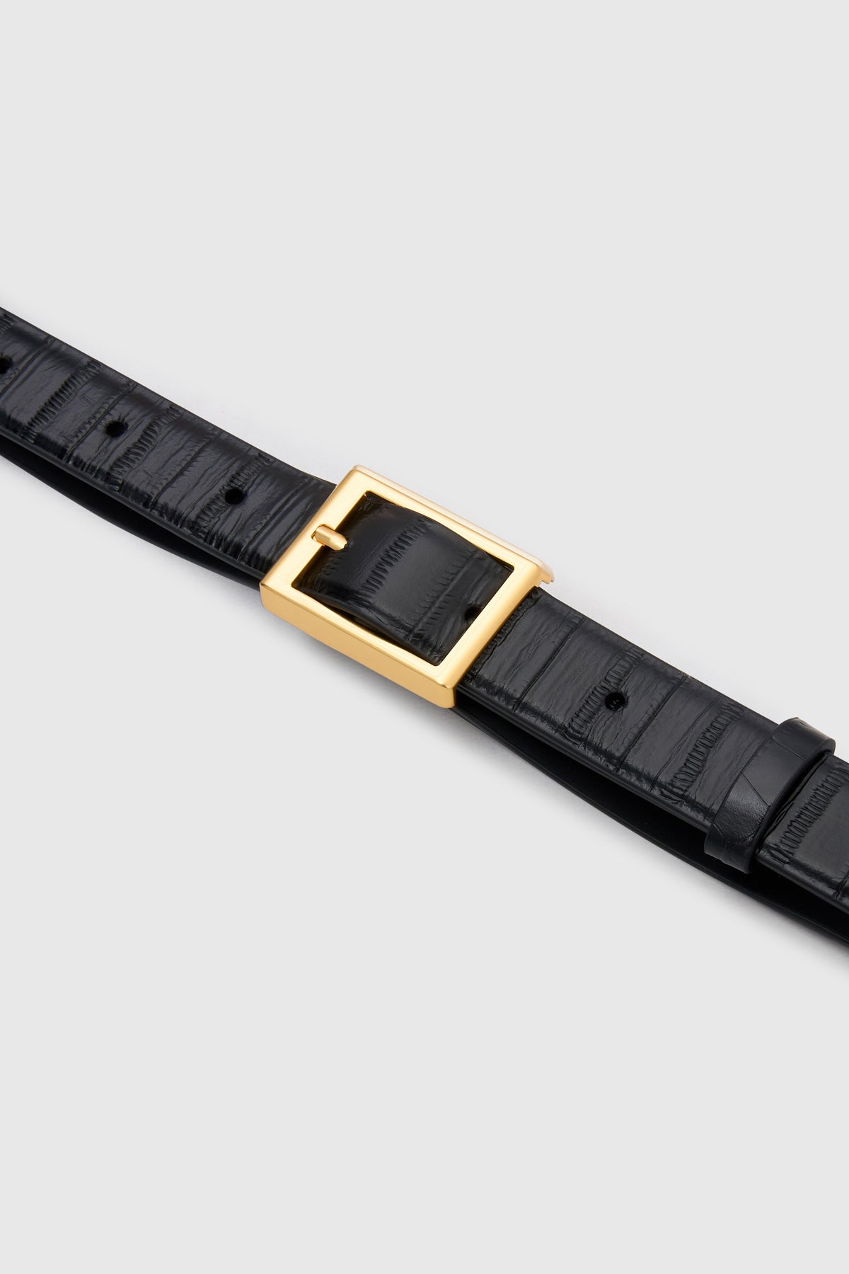 Cropped view CAMILLA AND MARC Sonny Eel Belt in Black leather with textured eel embossing.