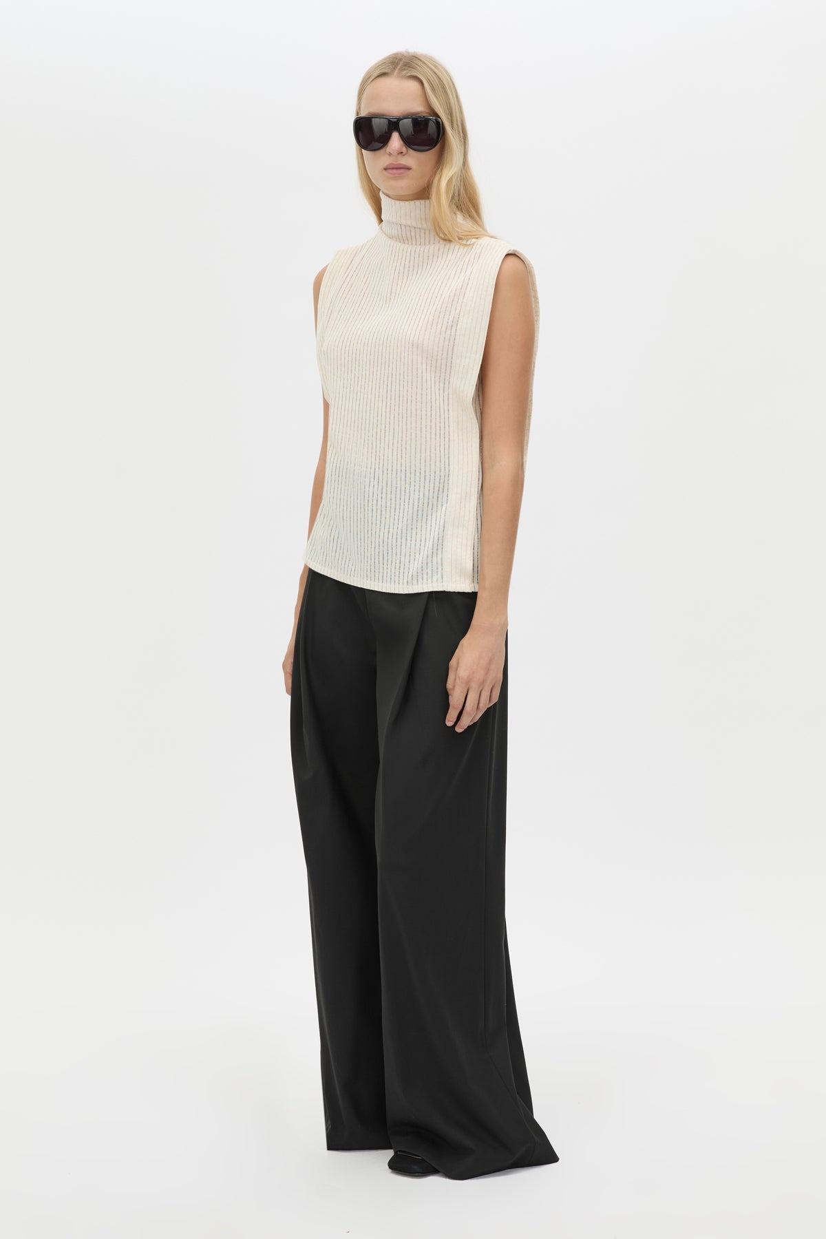 Three-quarter view CAMILLA AND MARC Talo Jersey Top in Cream with a boxy sleeveless cut.