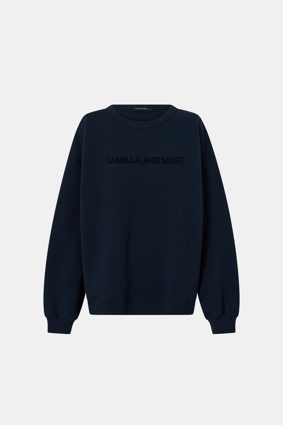Ghost view CAMILLA AND MARC Tia Flocking Logo Crew in Deep Ink with relaxed fit, logo artwork and 100% cotton.