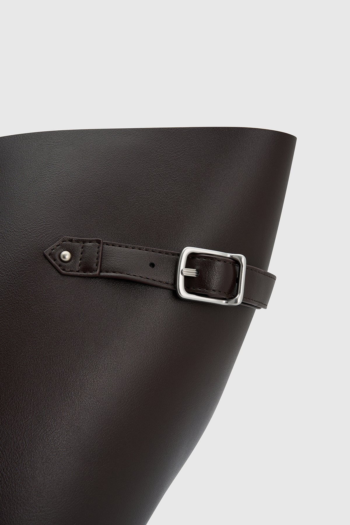 Cropped view CAMILLA AND MARC Willa Tote in Chocolate Brown with side strap and buckle detailing and magnetic button closure.