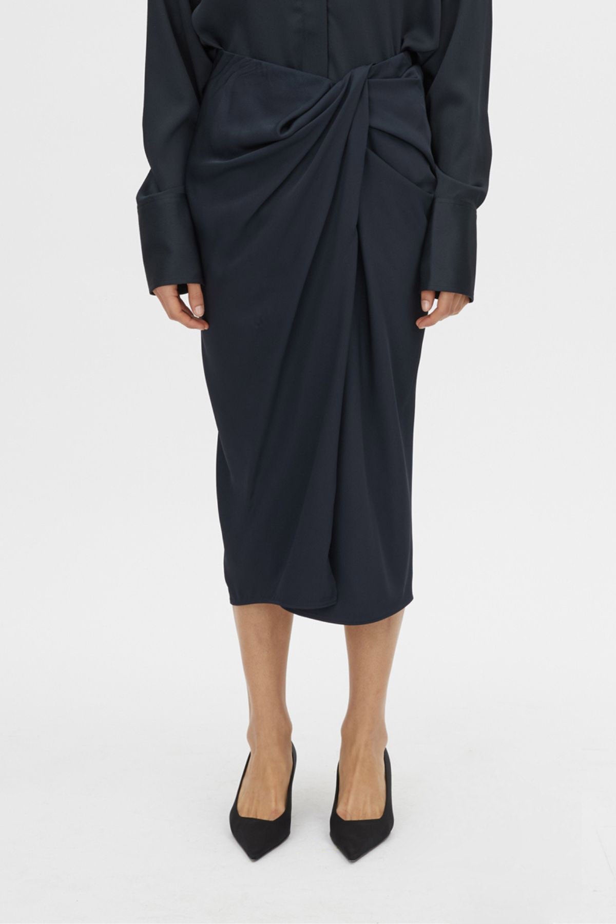 Cropped view CAMILLA AND MARC Elowyn Wrapped Midi Skirt in French Navy with front draped detailing.