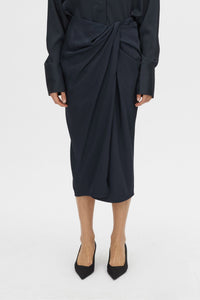 Cropped view CAMILLA AND MARC Elowyn Wrapped Midi Skirt in French Navy with front draped detailing.