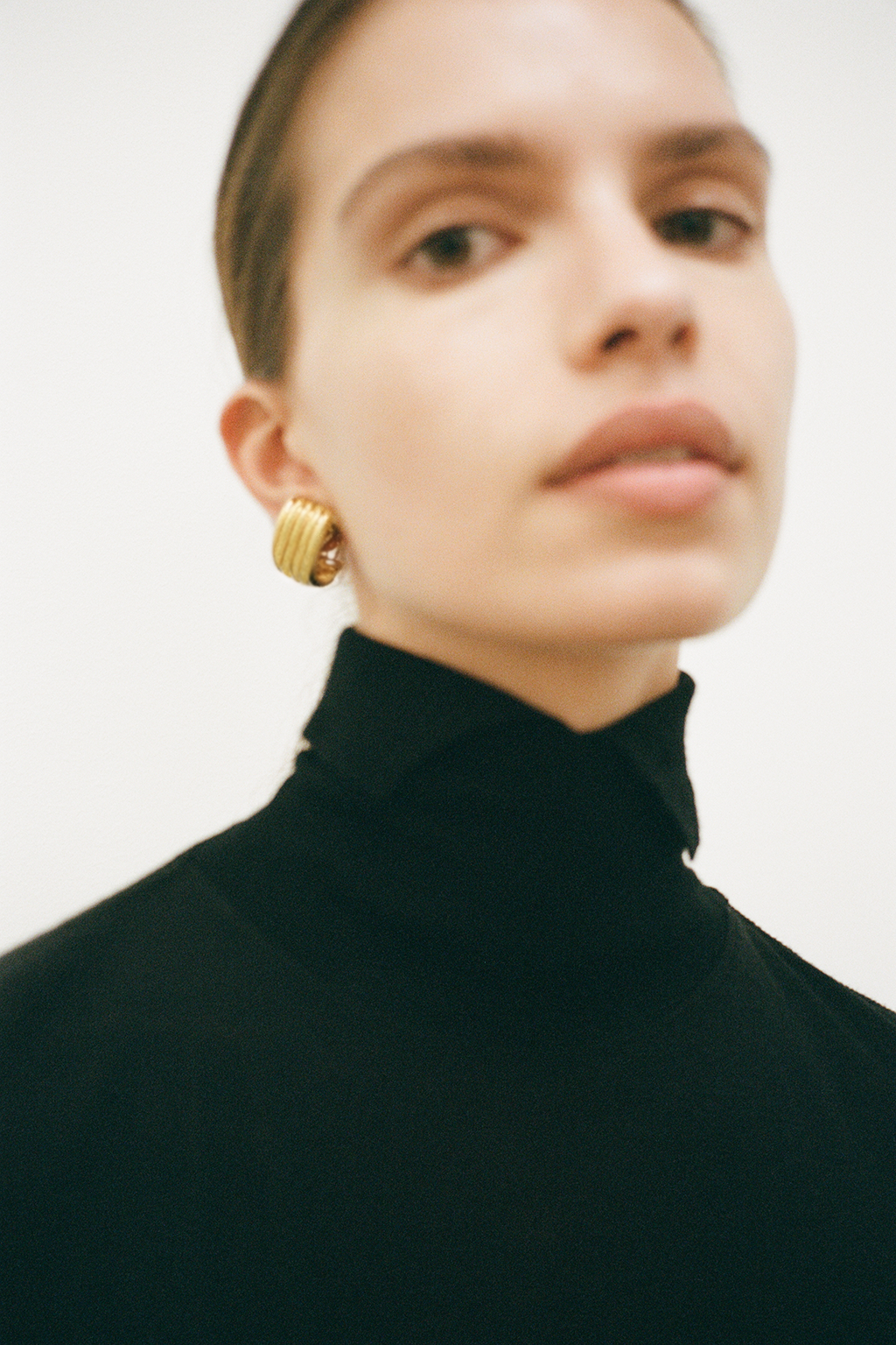 Styled Model View CAMILLA AND MARC Odin Stud Earrings 18k gold plated geometric studs.